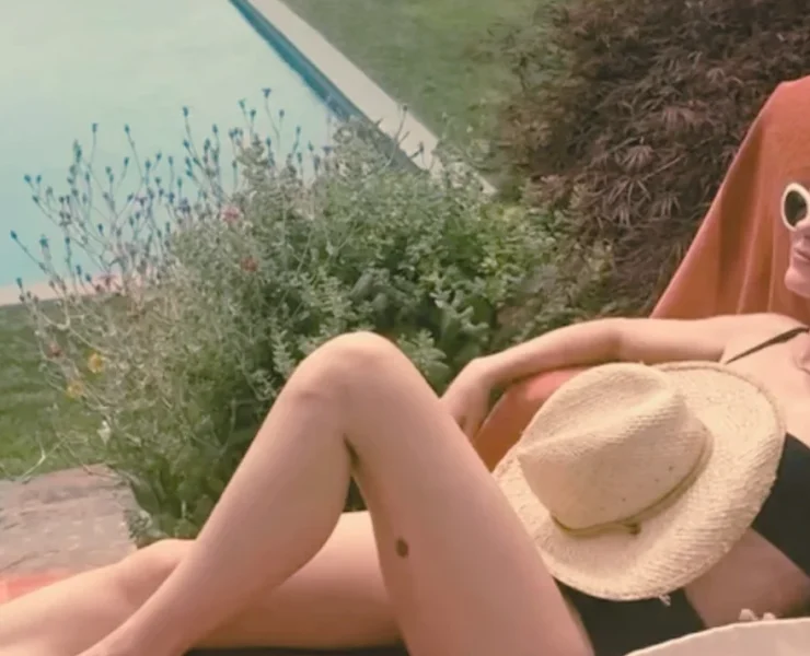 Naomi Watts sunbathing