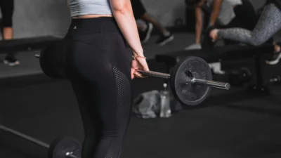 Young woman lifting at the gym.