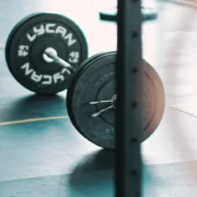 barbell with grinder plates at gym