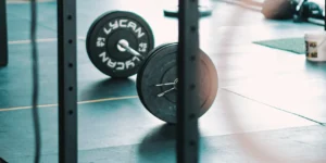 barbell with grinder plates at gym