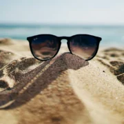 sunglasses in the sand at the beach