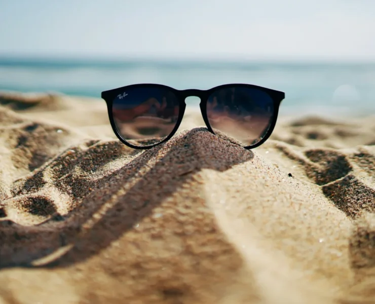 sunglasses in the sand at the beach