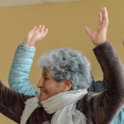 active senior with hands in the air like she just doesn't care
