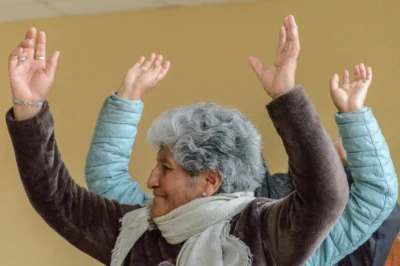 active senior with hands in the air like she just doesn't care