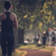 A woman running on a trail.