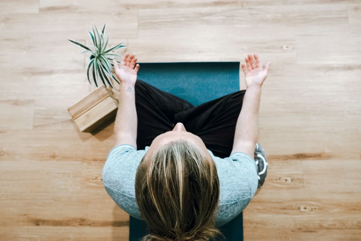 A woman meditating.