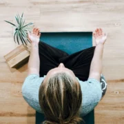 A woman meditating.