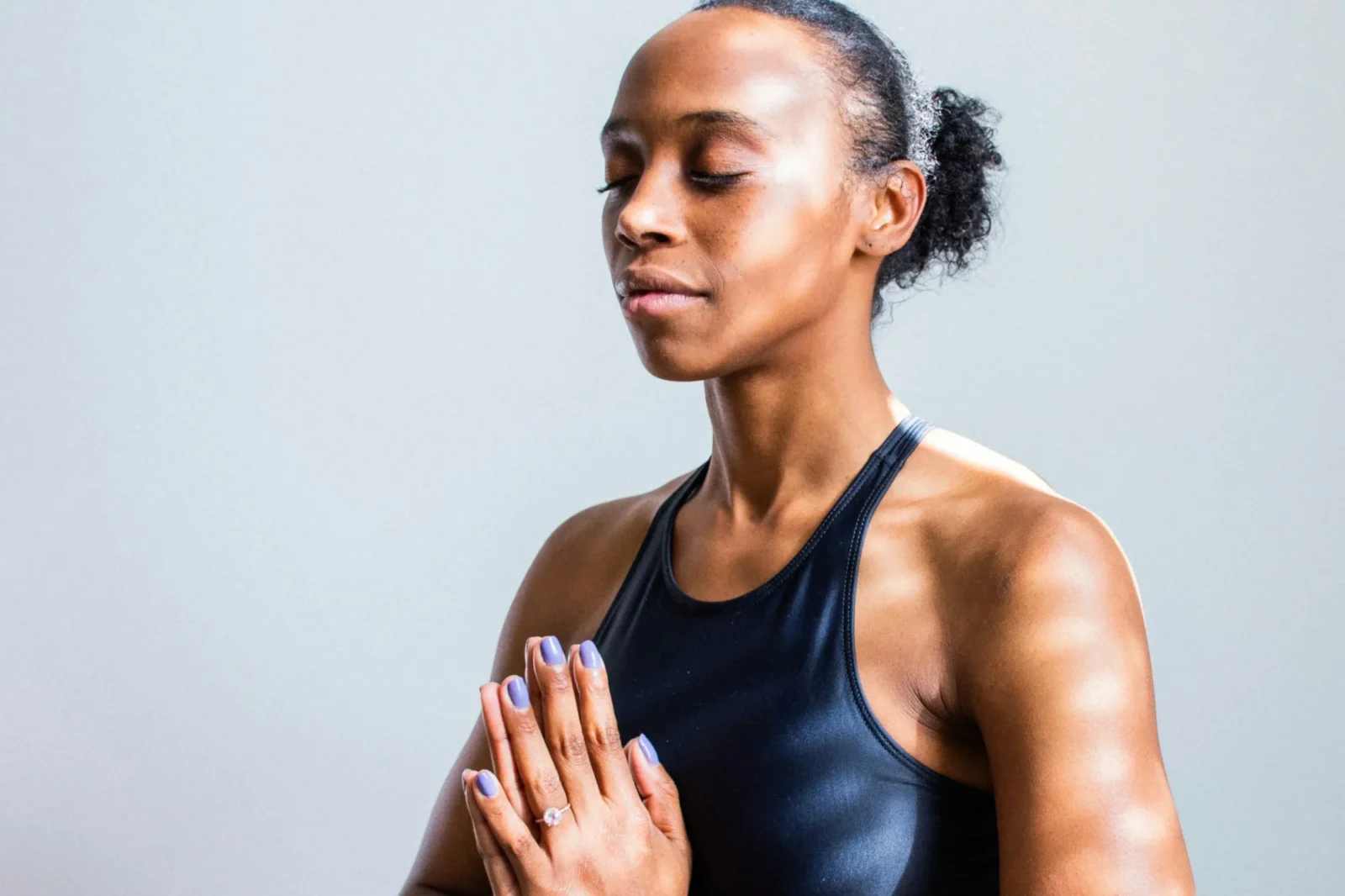 A woman meditating.