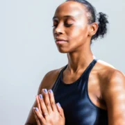 A woman meditating.