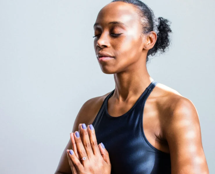 A woman meditating.