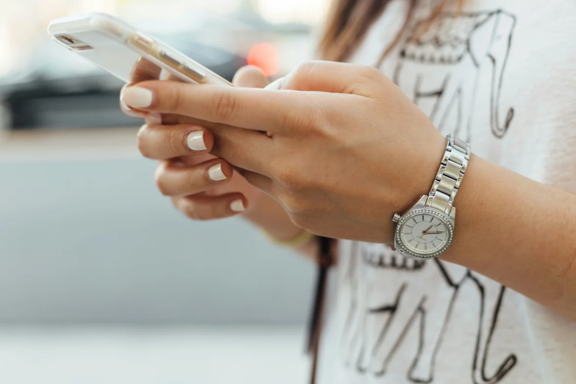 A woman looking at her phone.