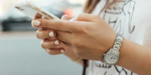 A woman looking at her phone.