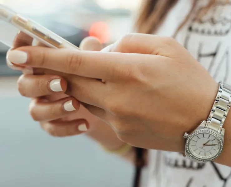 A woman looking at her phone.
