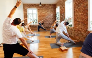 people pose inside a yoga studio