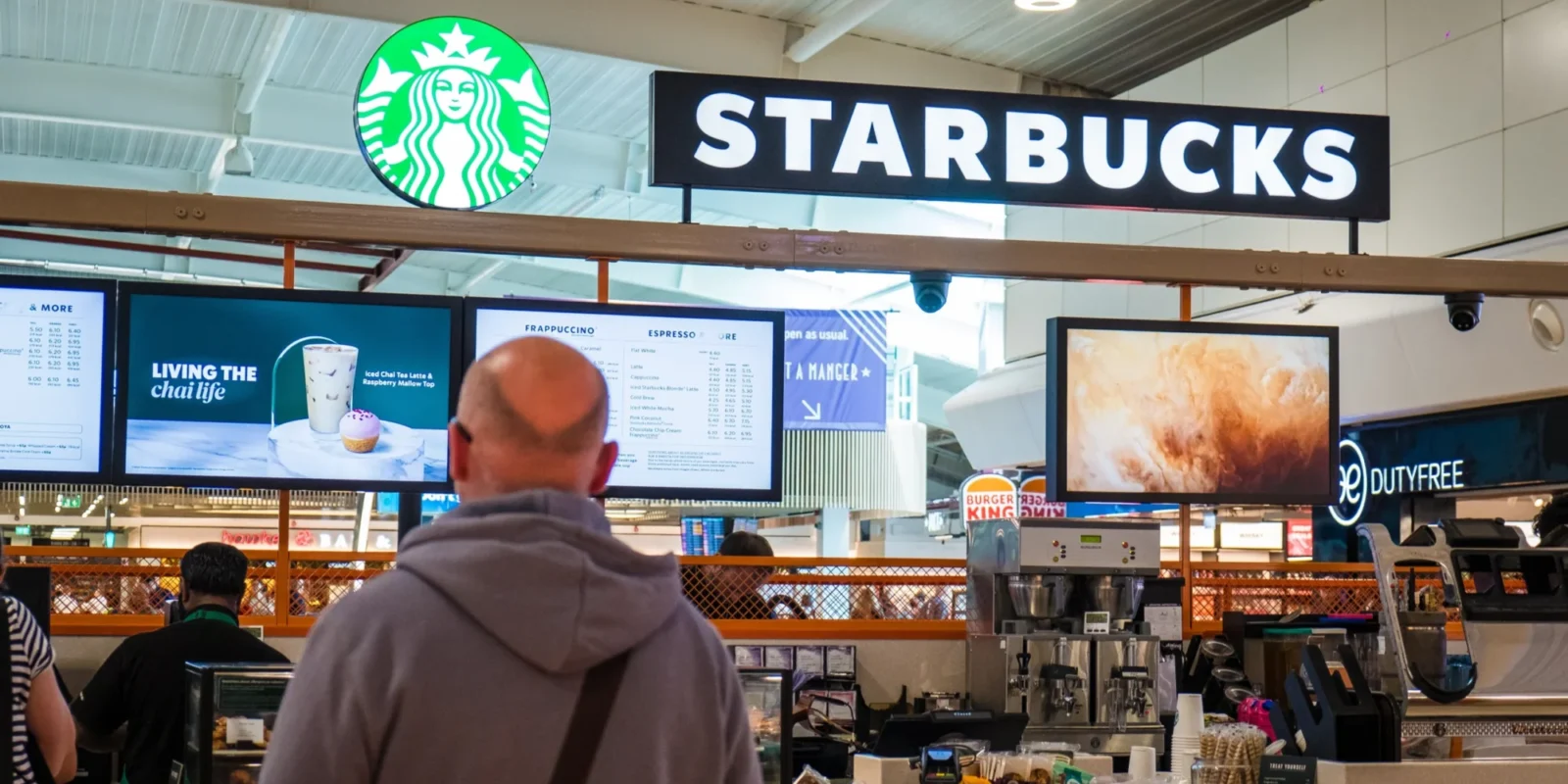 people standing in line at Starbucks