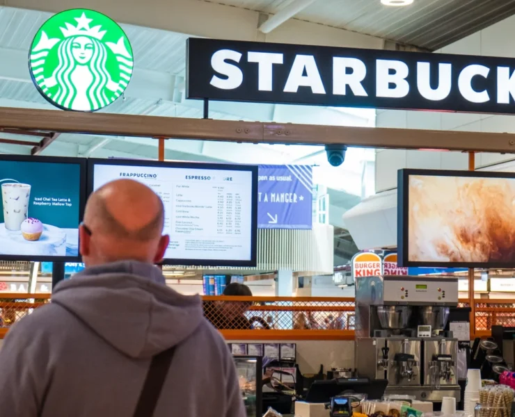 people standing in line at Starbucks