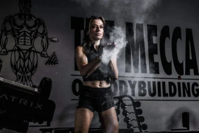 Anne Marie Chaker working out in a bodybuilding gym