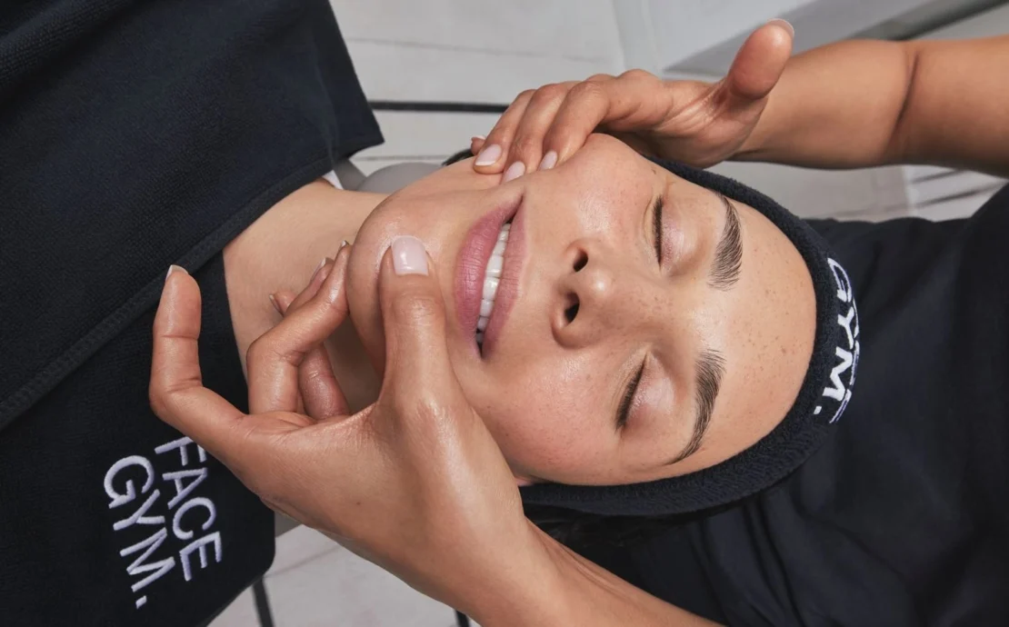 A woman receiving a treatment from FaceGym