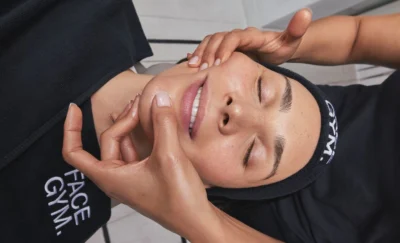 A woman receiving a treatment from FaceGym