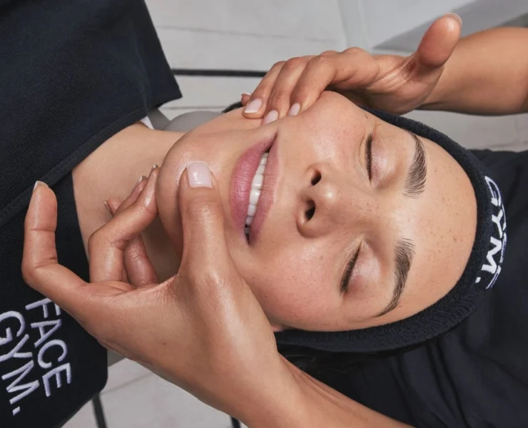 A woman receiving a treatment from FaceGym