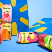 Bloom soda cans displayed next to Walmart bags