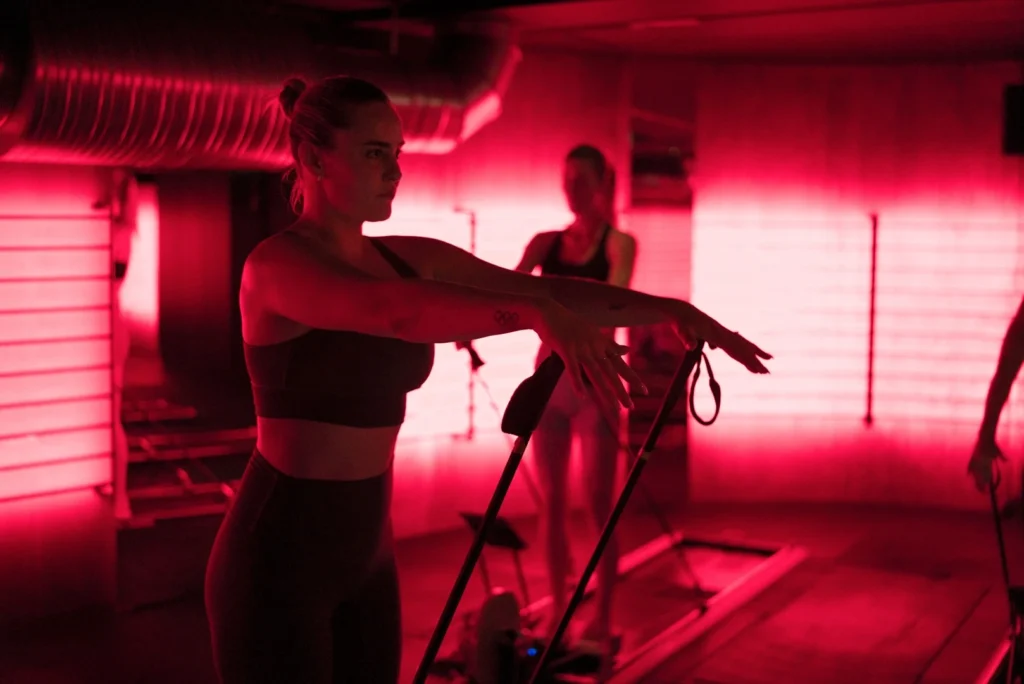 woman workouts out inside a Nordic Strong studio