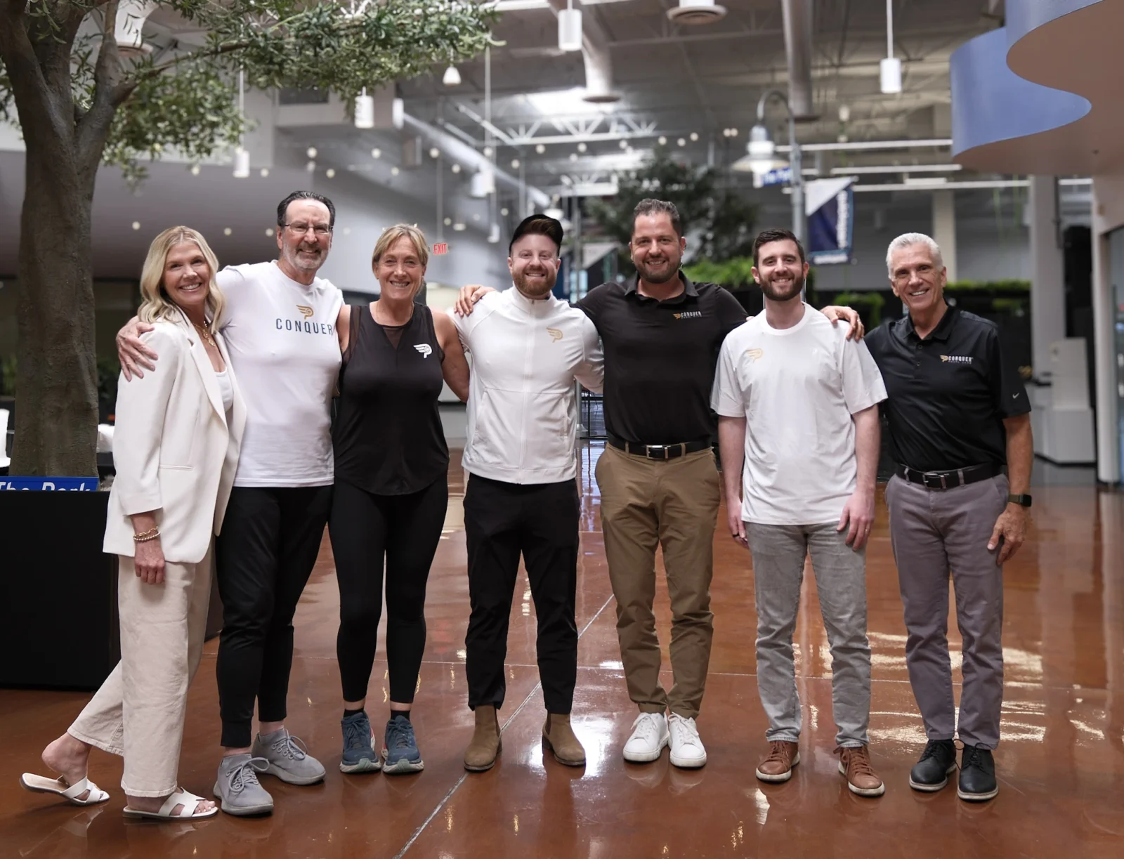 Alex and Greg Baker with the Conquer Padel team at their Tempe, AZ offices.