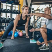 woman performs a sumo deadlift