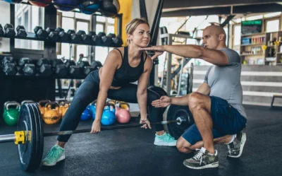 woman performs a sumo deadlift