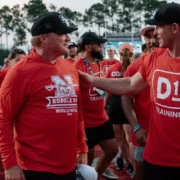 D1 Training CEO Will Bartholomew with Jon Gruden, former NFL head coach, former Monday Night Football broadcaster, and current Barstool Sports personality