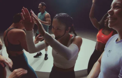 an instructor leads a group fitness class