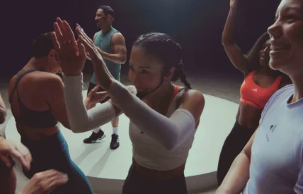 an instructor leads a group fitness class