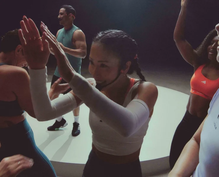 an instructor leads a group fitness class