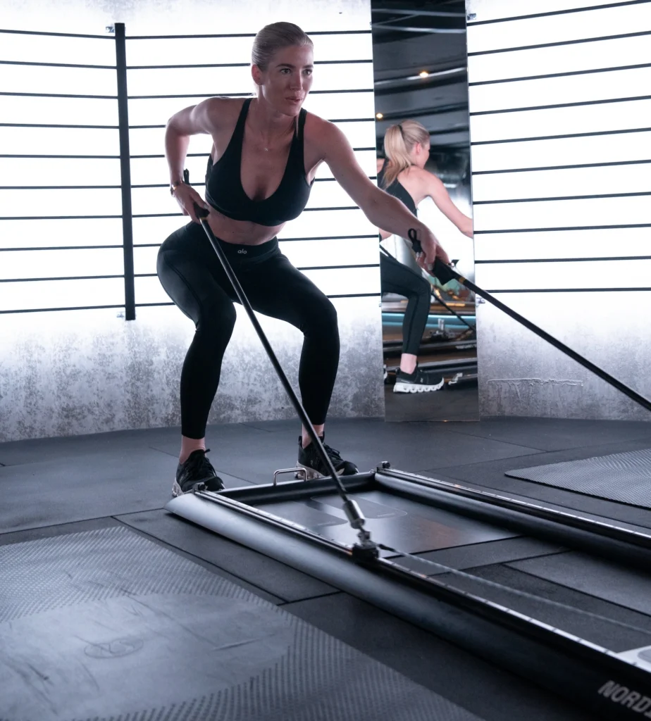 Nicole Roth demos the Nordic Trainer patented machine