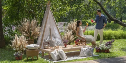 A couple at a glamping site.