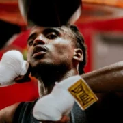 man boxes with a pair of Everlast gloves