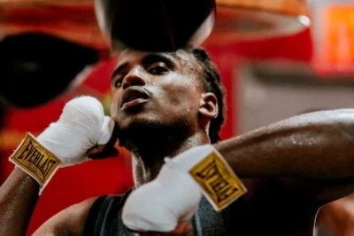 man boxes with a pair of Everlast gloves