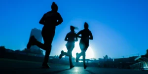 women running in blue light