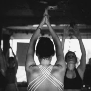 A yoga teacher teaching a class