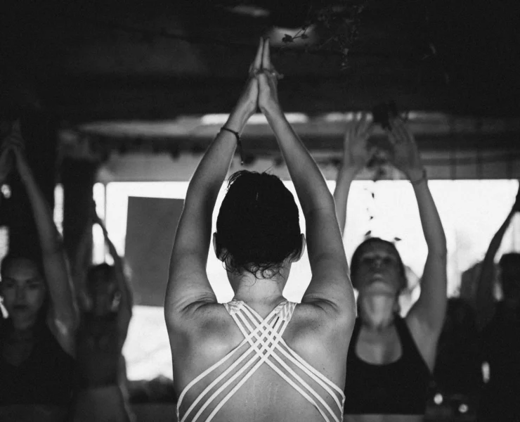 A yoga teacher teaching a class
