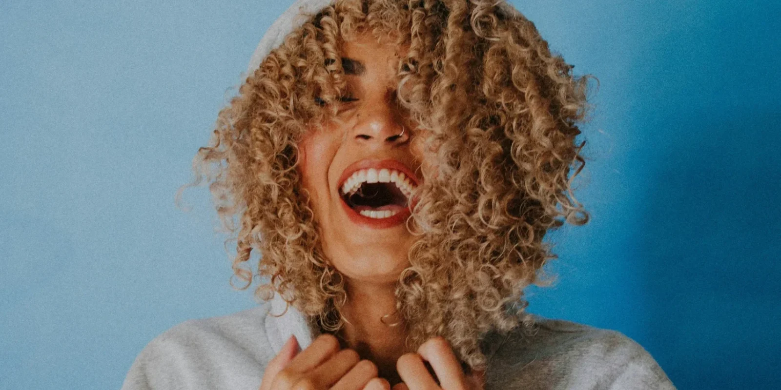 woman laughing into the camera