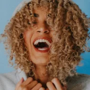 woman laughing into the camera