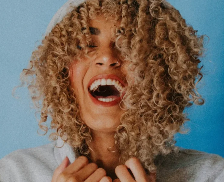 woman laughing into the camera
