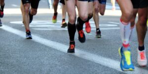people running on pavement