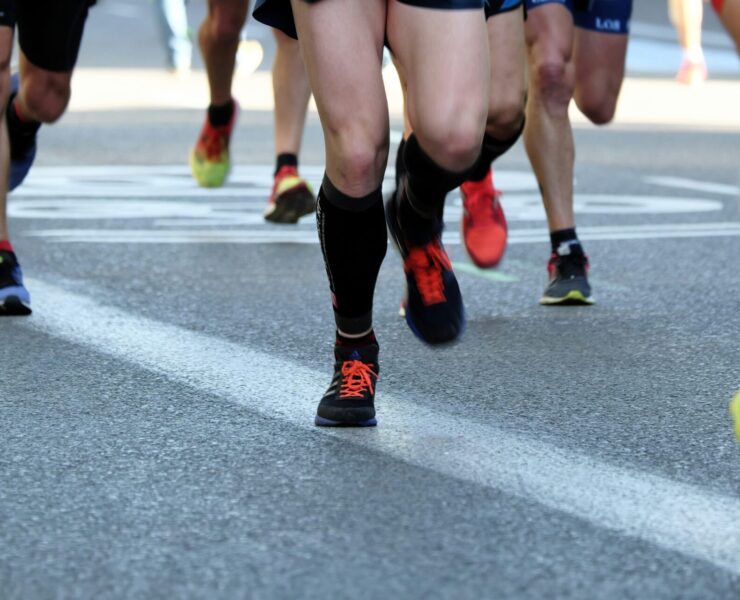 people running on pavement