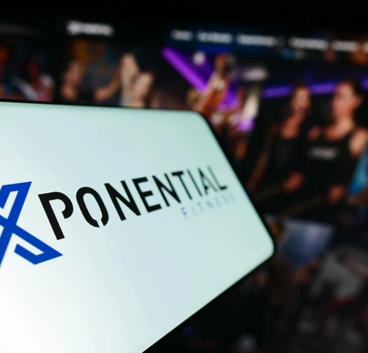 phone shows an Xponential Fitness logo