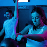 Clients working out under blue lights in RevFit.