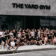 people line up for a photo outside of The Yard Gym