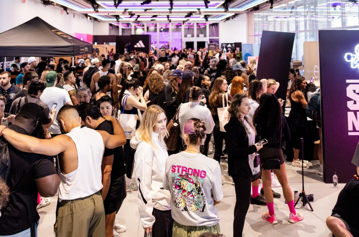 people gather on the expo floor at Strong New York