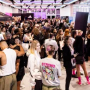 people gather on the expo floor at Strong New York